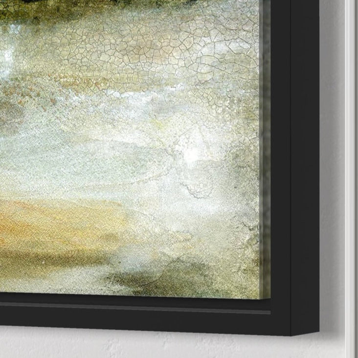 Abstract art piece with a black frame on a white wall
