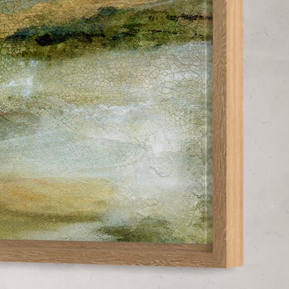Framed abstract painting with a textured surface on a white wall