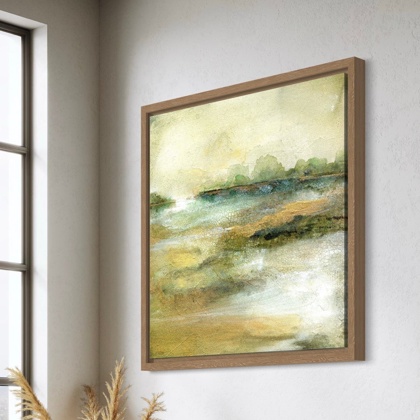Framed abstract painting on a wall next to a window