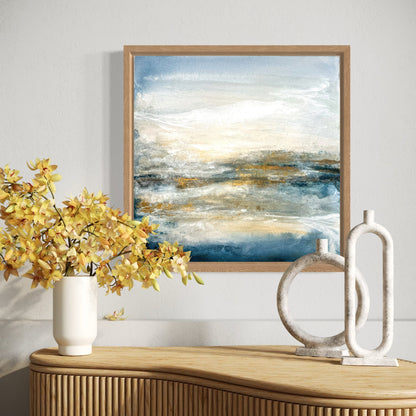 Framed abstract painting on a wall above a wooden console table with decorative items.