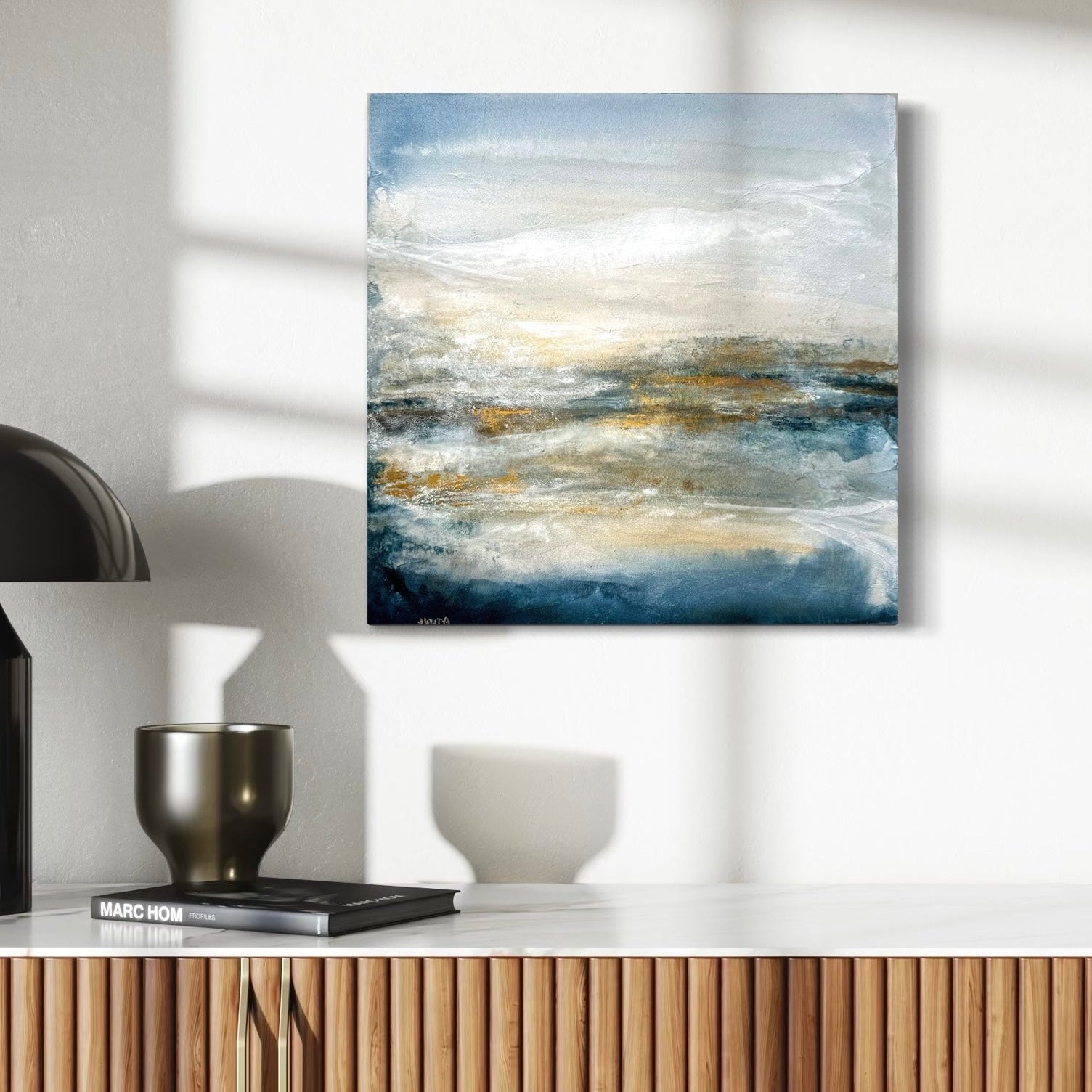 Abstract painting on a wall with decorative items below