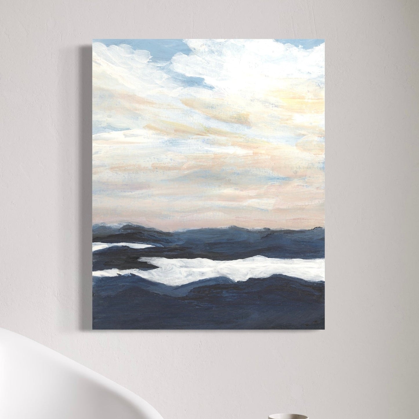 Abstract painting of a landscape with blue and white tones on a wall.