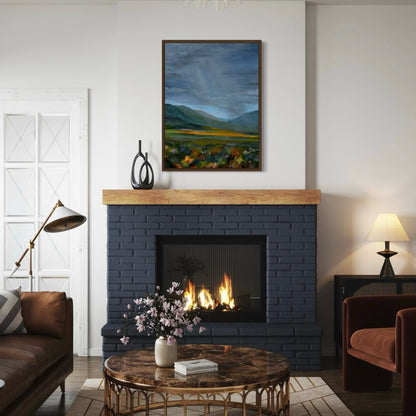 Modern living room with a fireplace, coffee table, and artwork.