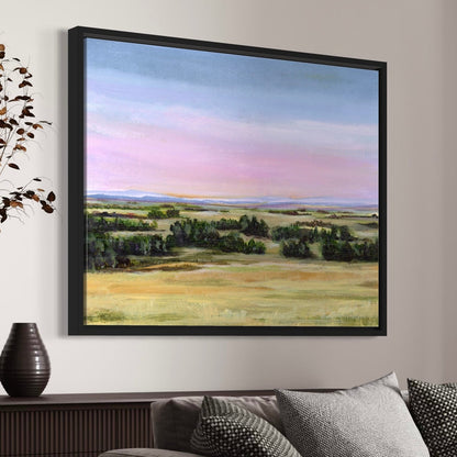 Framed landscape painting on a wall above a sofa