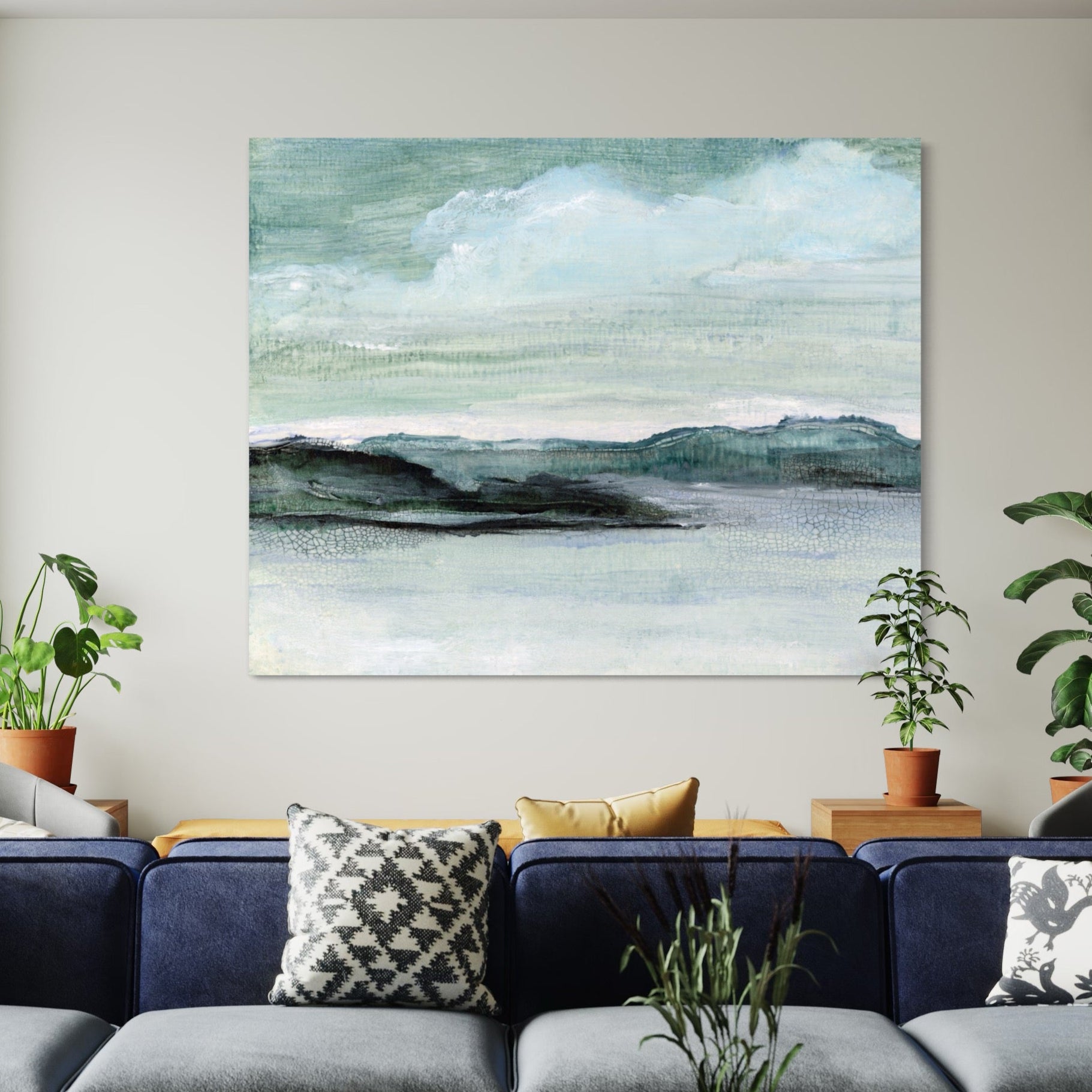 Modern living room with a blue sofa, coffee table, and wall art.