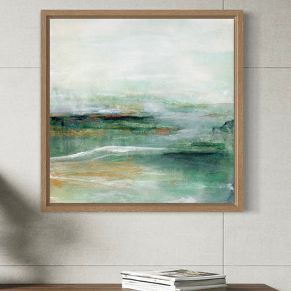 Framed abstract painting on a wall above a wooden table with books.